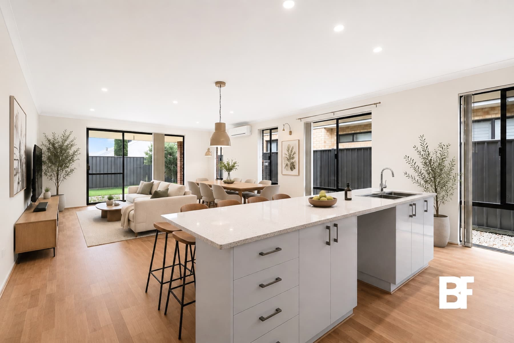 Bright open-plan kitchen, dining and living space photographed by BASEFORM